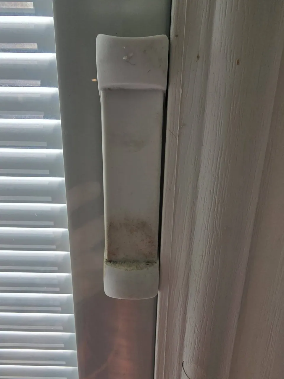 Before: grimy door and blind hardware